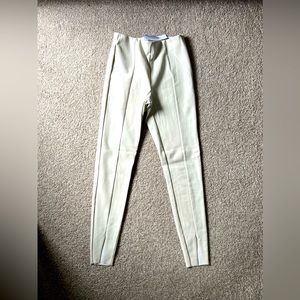 Topshop faux leather skinny pants with front hem slits in off white